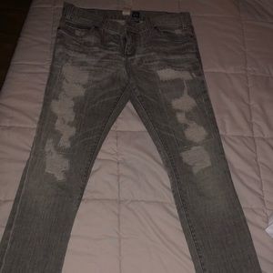 Grey distressed denim jeans